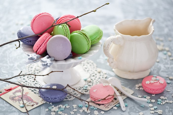 Macarons in a bowl with a jug container