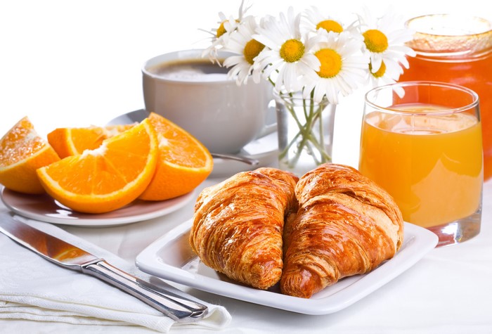 Breakfast with Croissants, Orange Juice, Coffee, and Chamomile