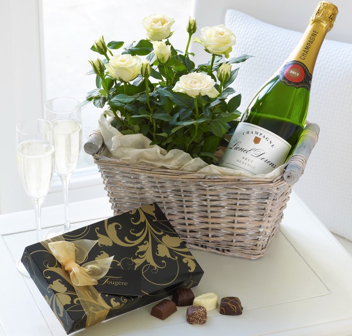 Champagne, Roses, Chocolates, and Glasses in a Basket