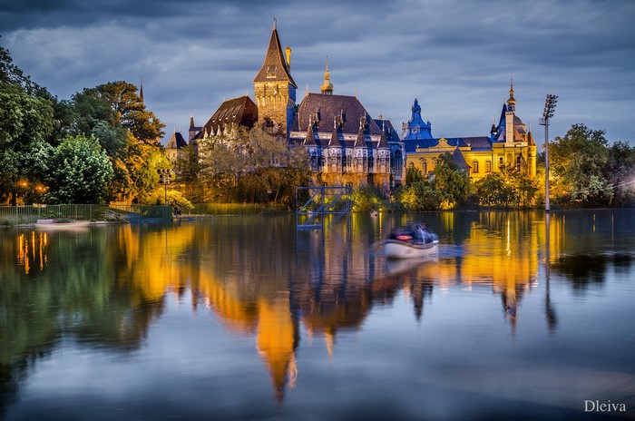 Vajdahunyad Castle reflected in water at dusk