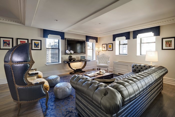 Luxurious living room with tufted sofa and armchair