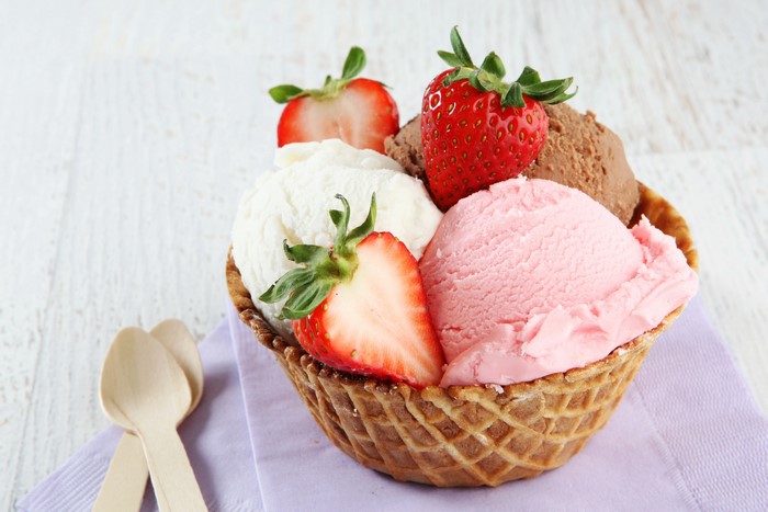 Ice cream with strawberries in a waffle bowl