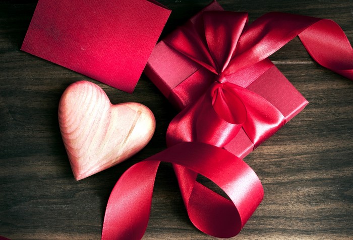 Valentine's Day gift with red ribbon and heart