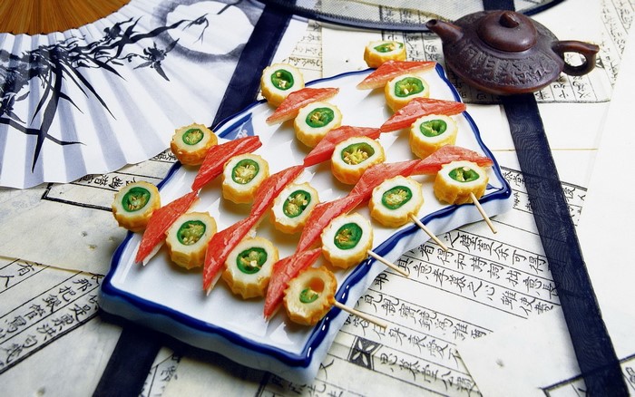 Sushi with crab sticks and green peppers on a plate
