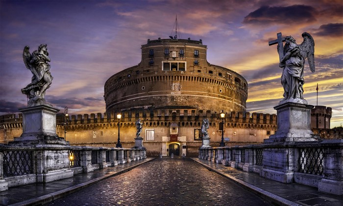 Castel Sant'Angelo and angel sculptures at dusk, Rome, Italy