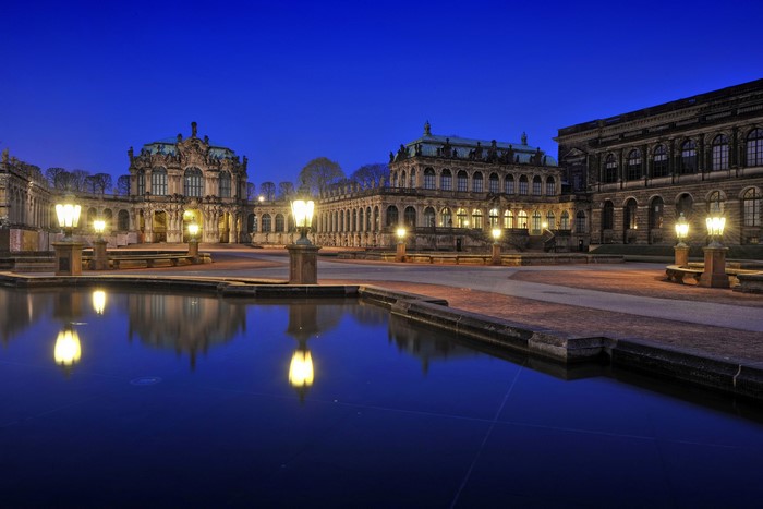 Zwinger Palace courtyard at night with illuminated lamps
