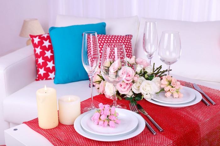 Table setting with roses and candles