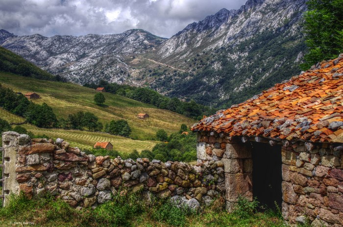 Stone buildings and mountains in Cantabria, Spain