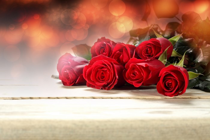Red Roses on a Wooden Surface