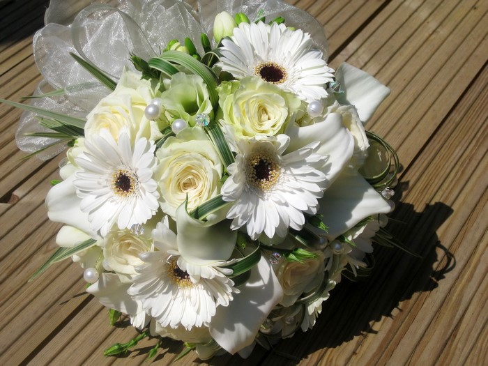 White wedding bouquet with gerberas, roses, and callas