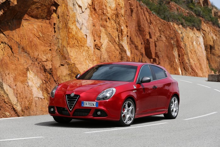 Red Alfa Romeo Giulietta QV on a Road