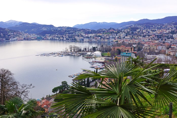 Lugano, Switzerland cityscape with lake and mountains