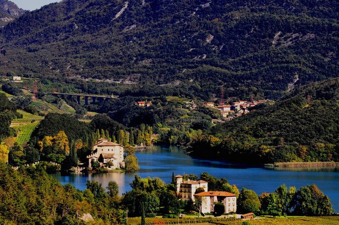 Houses and scenery by a lake in Calavino, Italy