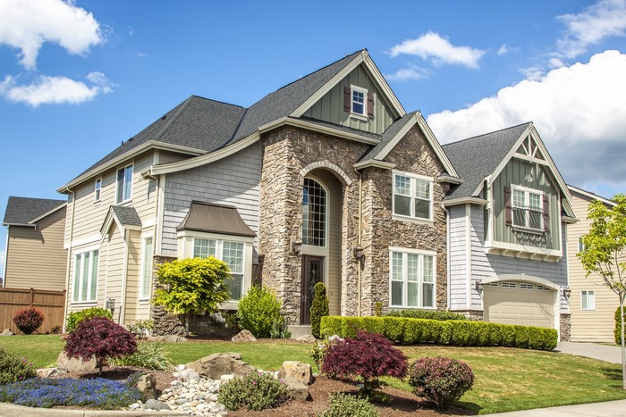 Luxury Mansion with Stone Facade and Landscaping