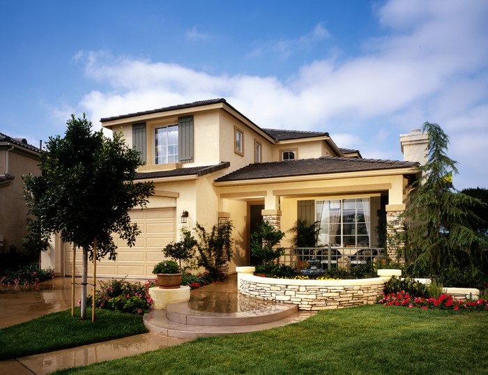 Luxury house with manicured lawn and garden