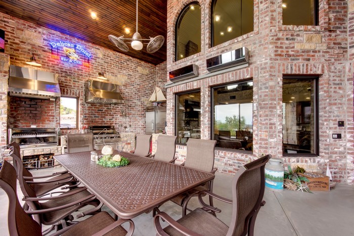 Outdoor Kitchen and Dining Area with Brick Walls