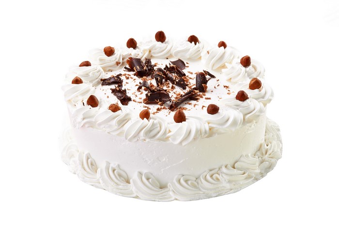 White cake with chocolate shavings and hazelnuts