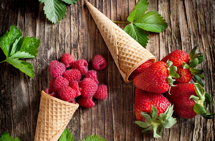 Ice cream cones with strawberries and raspberries