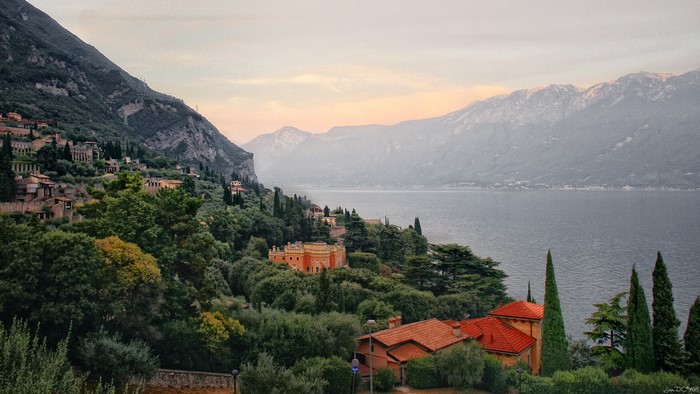 Houses on a hillside overlooking a lake in Gargnano, Italy