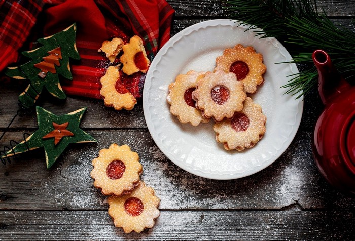 Christmas Linzer cookies with jam on a plate