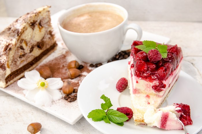 Raspberry cake and coffee with hazelnuts