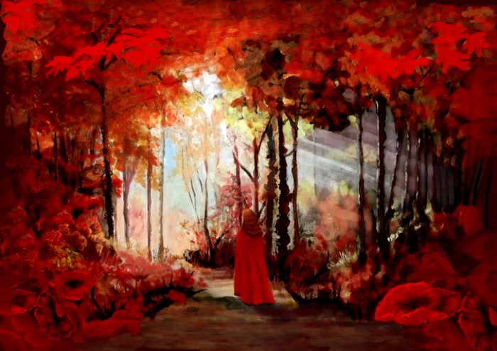 Autumn forest with a person in a red cloak