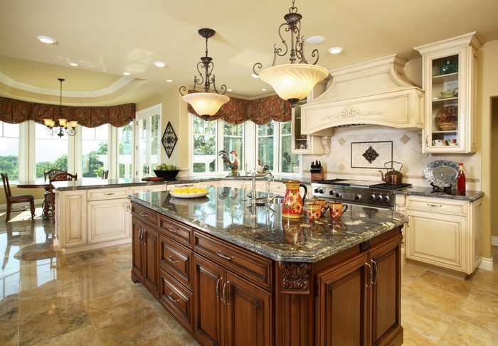 Luxury kitchen with island and ornate chandeliers