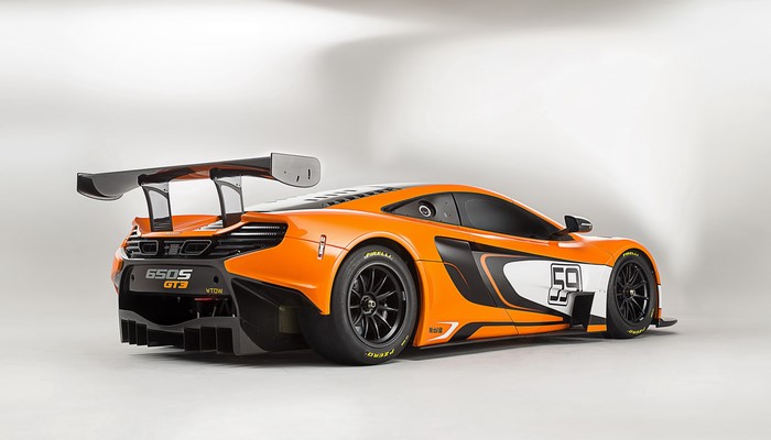 Orange McLaren 650S GT3 race car from behind