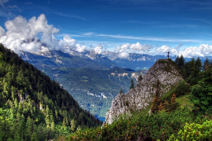 Mountain landscape with cross on peak in Bavaria, Germany