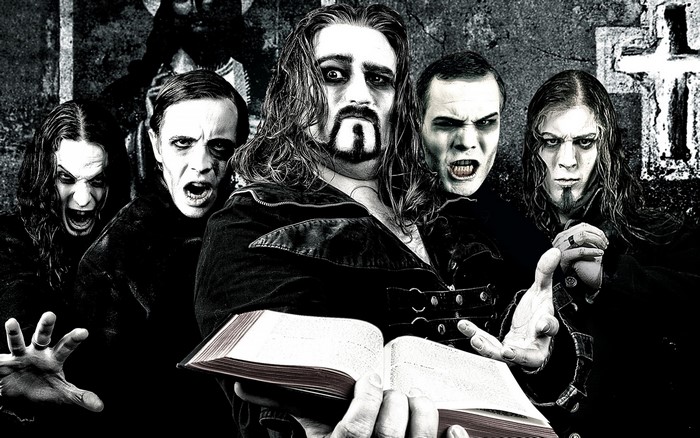 Powerwolf band members with a book