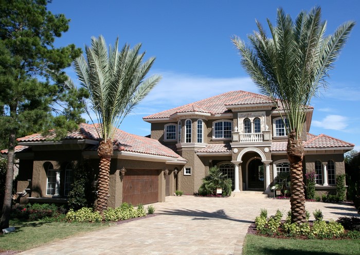 Luxury Mansion with Palm Trees and Tile Roof