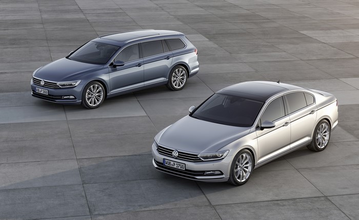 Two Volkswagen Passat cars on pavement