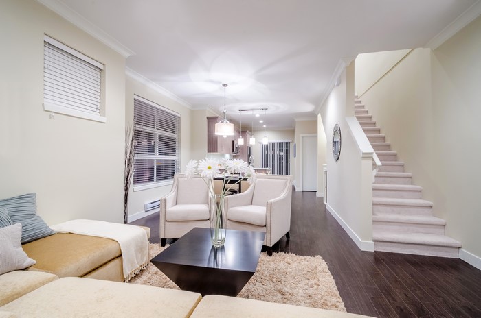 Interior of a living room with stairs and sofa