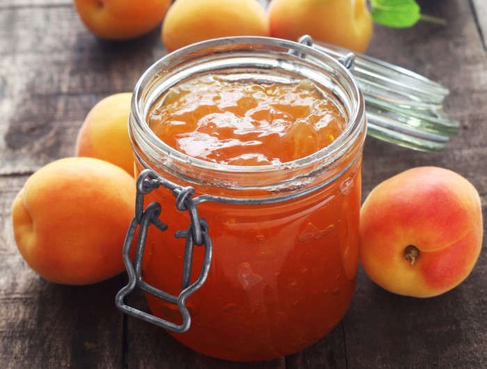 Apricot jam in a jar with apricots