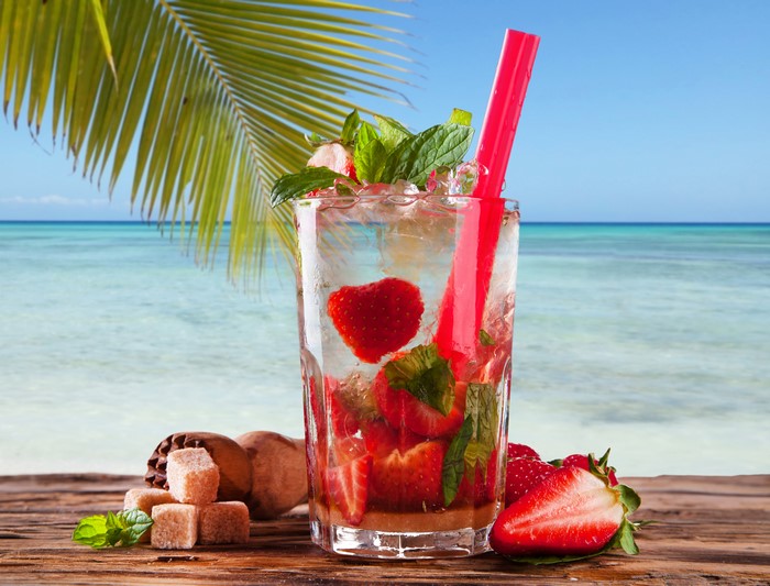 Strawberry Mojito Drink on Beach Background