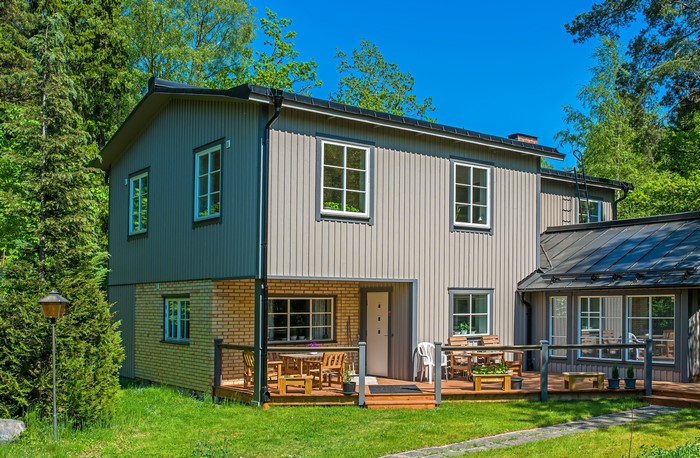 House in Vaxholm, Sweden with green grass