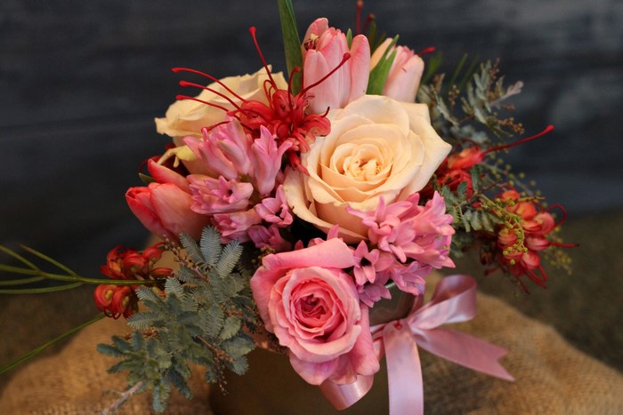 Pink and cream flower bouquet with roses, tulips, and hyacinths