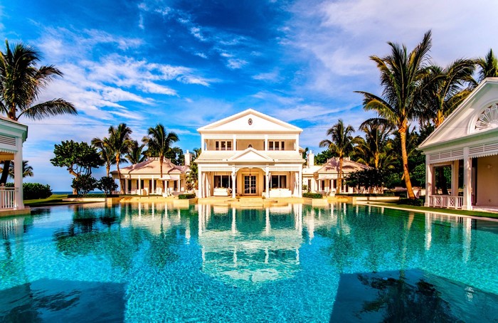 Luxury resort with swimming pool and palm trees