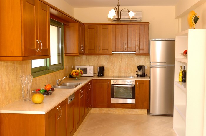 Modern wooden kitchen with stainless steel appliances