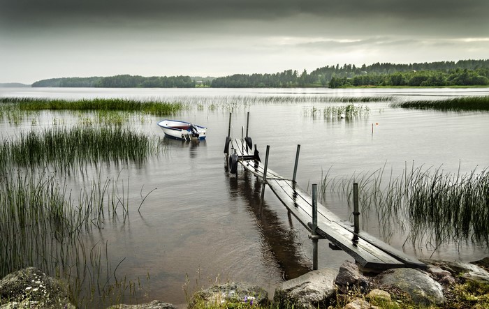 Boat and dock on a lake in Sweden