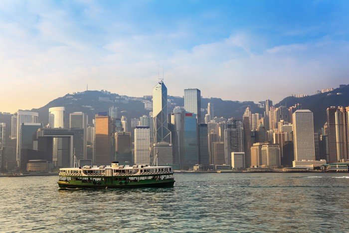 Hong Kong harbor with Star Ferry and skyscrapers