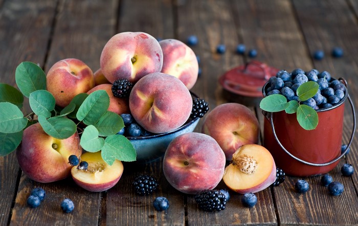 Peaches, Blackberries, and Blueberries on a Wooden Table
