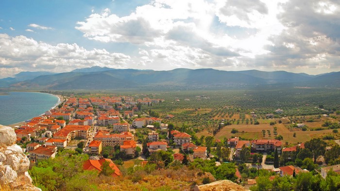 Paralio Astros, Greece: Coastal Town with Red Roofs and Mountains