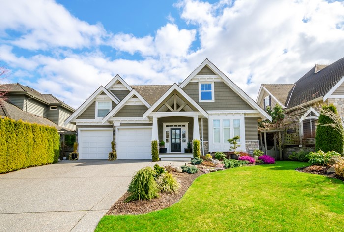 Suburban House with Lawn and Landscaping