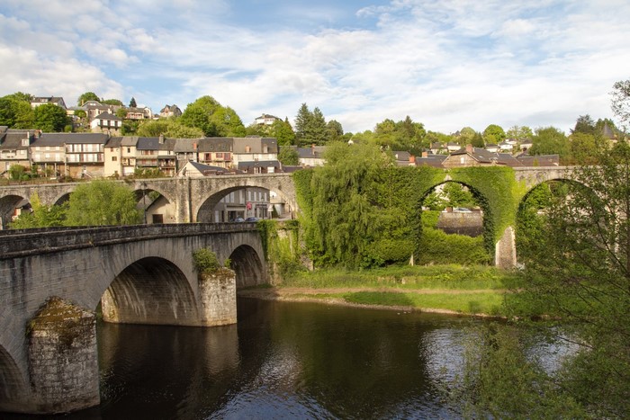 Bridges and houses over a river in Uzerche, France