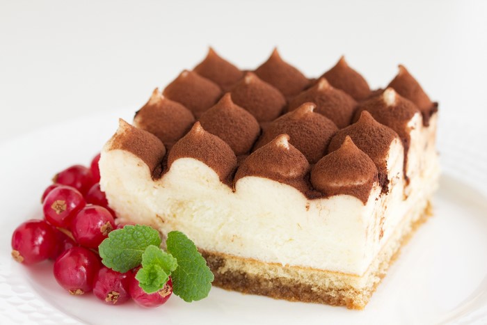 Tiramisu cake with red currants and mint