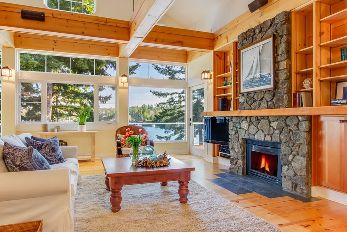 Living room with fireplace and lake view