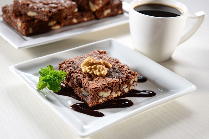 Chocolate brownies with walnuts and coffee