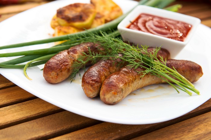 Sausages with potatoes, dill, and ketchup