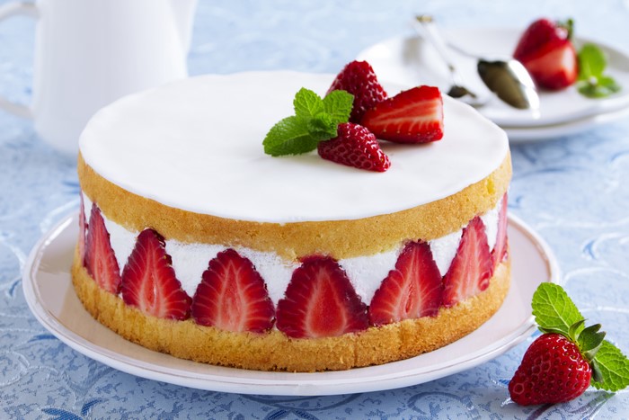 Strawberry Cake with White Frosting and Mint